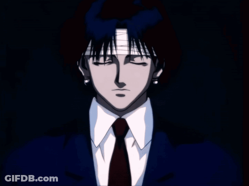 A Silhouette Of A Person Standing In Front Of A Window Looking Out At A City At Night GIF