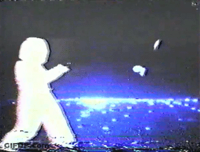 A Silhouette Of A Person Walking In The Dark With A Blue Background GIF