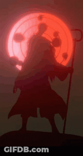 A Silhouette Of A Person With A Cane In Front Of A Red Moon GIF