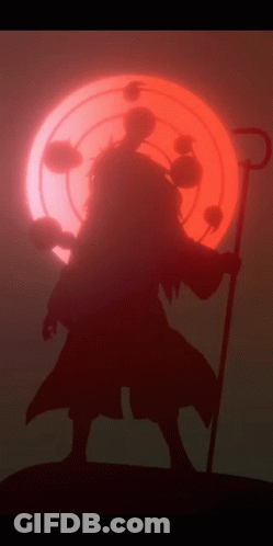 A Silhouette Of A Person With A Cane In Front Of A Red Sun GIF