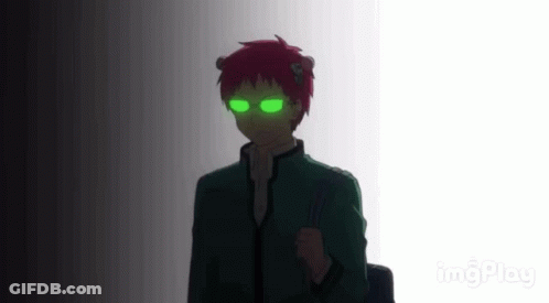 A Silhouette Of A Person With Green Eyes And Red Hair Standing In A Dark Room . GIF