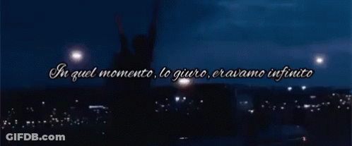 A Silhouette Of A Person With Their Arms In The Air And The Words In Quel Momento Lo Giuro Eravamo Infinito GIF