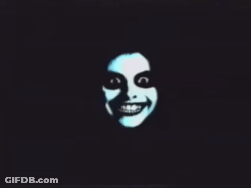 A Silhouette Of A Smiling Face With A Black Background GIF
