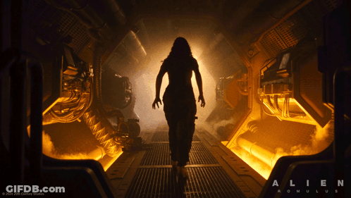 A Silhouette Of A Woman In A Dark Room With The Words Alien Romulus On The Bottom GIF