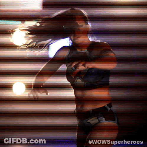 A Silhouette Of A Woman With #Wowsuperheroes On The Bottom Right GIF