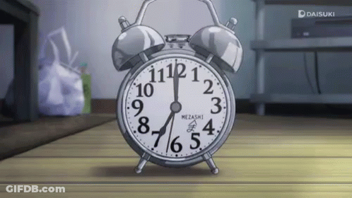 A Silver Alarm Clock That Says Mezashi On The Face GIF