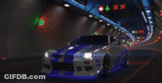 A Silver And Blue Car Is Driving Through A Tunnel At Night GIF