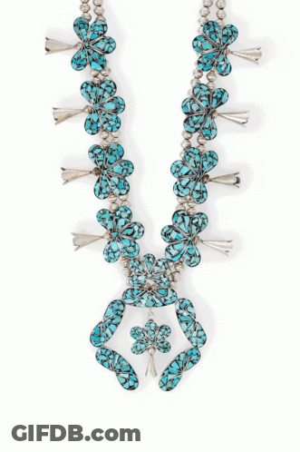 A Silver And Turquoise Ring With A Circle Of Turquoise Stones GIF