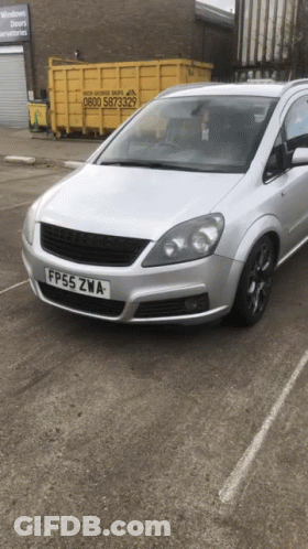 A Silver Car Has A License Plate That Says Fp55zwa GIF