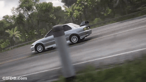 A Silver Car Is Driving Down A Road With Trees In The Background . GIF