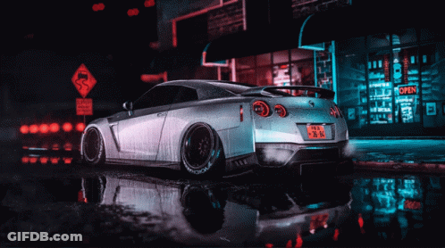 A Silver Car Is Parked In Front Of A Store That Says Open GIF