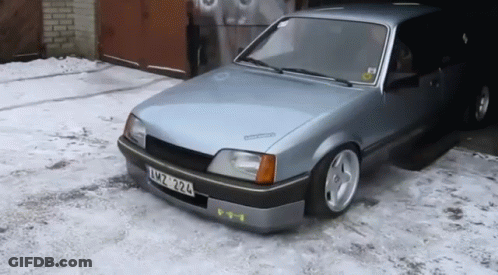 A Silver Car With A License Plate That Says Xmz 324 GIF