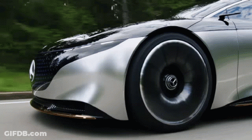 A Silver Car With A Mercedes Logo On The Front GIF