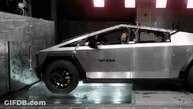 A Silver Car With The Number Test-87566 On The Side GIF