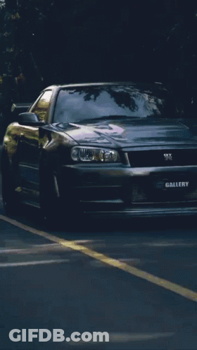 A Silver Car With The Word Gallery On The Front Of It GIF