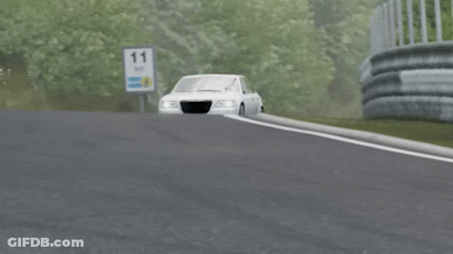 A Silver Chrysler Car Is Driving Down A Highway GIF