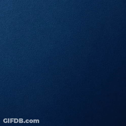 A Silver Circle On A Blue Background With A Reflection GIF