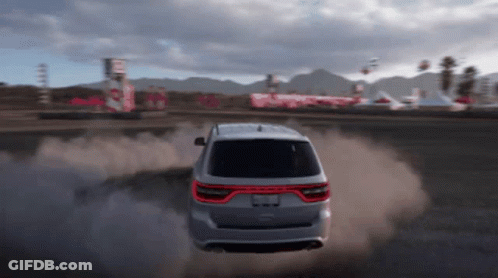 A Silver Dodge Durango Is Driving On A Dirt Road In A Video Game GIF