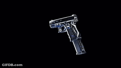 A Silver Gun With A Magazine Is Sitting On A Black Background . GIF