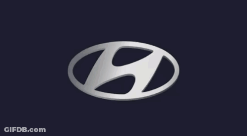 A Silver Hyundai Logo On A Dark Background GIF