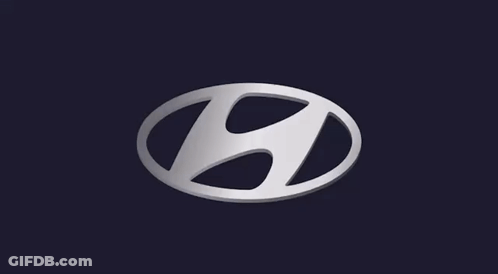 A Silver Hyundai Logo On A Dark Background GIF