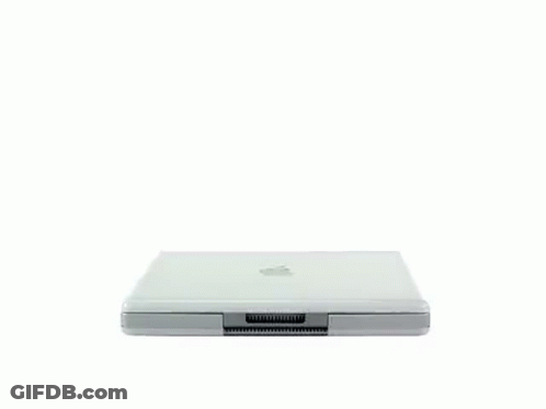 A Silver Ibook Laptop Is Open And Displaying A Blue Screen GIF