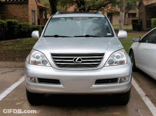 A Silver Lexus Suv Is Parked In A Parking Spot GIF