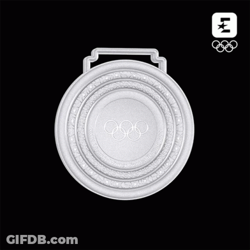 A Silver Medal With The Olympic Rings On The Front GIF