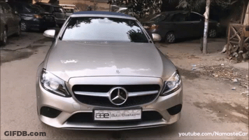 A Silver Mercedes With A License Plate That Says Ae GIF