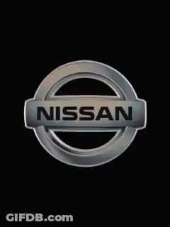 A Silver Nissan Logo Is On A Black Background . GIF