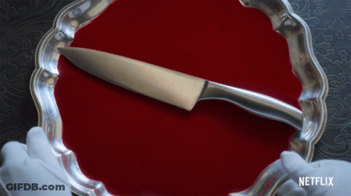 A Silver Plate With A Knife On It And A Netflix Logo In The Corner GIF