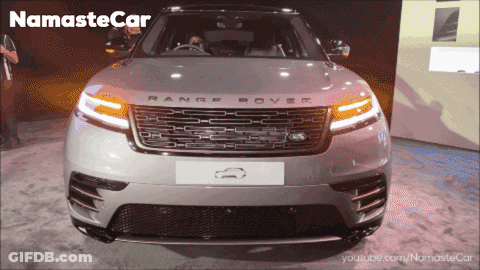 A Silver Range Rover Is On Display At A Namaste Car Show GIF