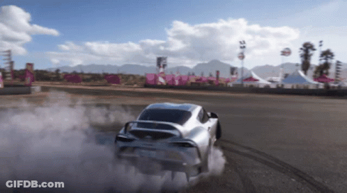 A Silver Sports Car Is Drifting On A Track GIF