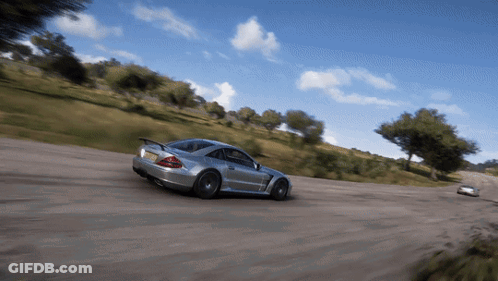 A Silver Sports Car Is Driving Down A Dirt Road With A Yellow License Plate GIF