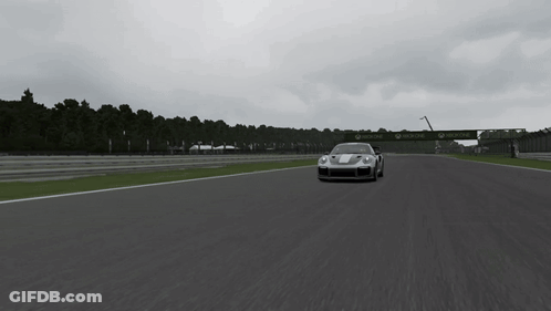 A Silver Sports Car Is Driving On A Track With A Sign That Says ' Allianz ' On It GIF