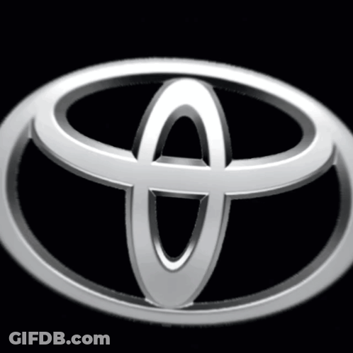 A Silver Toyota Logo Is Against A Black Background GIF