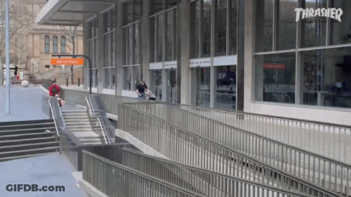 A Skateboarder Is Doing A Trick In Front Of A Thrasher Building GIF