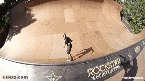 A Skateboarder Is Doing A Trick On A Ramp That Says Rockstar Energy Drink On It GIF
