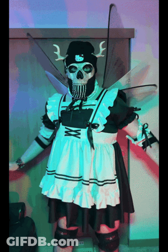 A Skeleton Dressed As A Maid With Wings And A Knife GIF