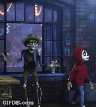 A Skeleton In A Cowboy Hat Is Standing In Front Of A Brick Wall GIF