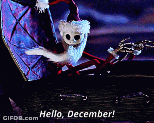 A Skeleton In A Santa Hat Is Sitting In A Coffin And Says Hello December GIF