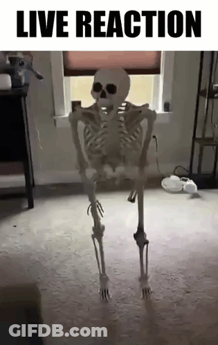A Skeleton Is Dancing In A Living Room With The Words `` Live Reaction '' Written Above It . GIF
