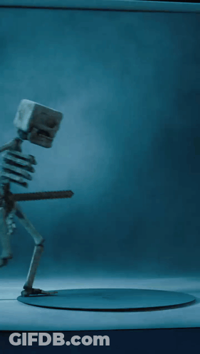 A Skeleton Is Holding A Sword In His Hand GIF