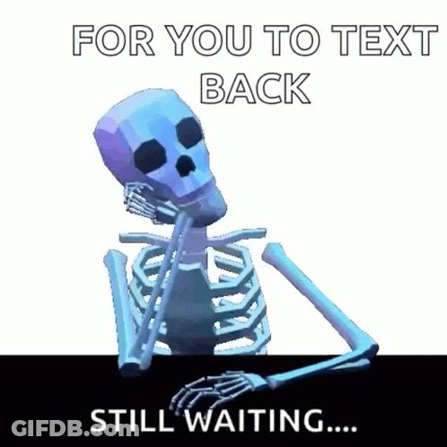A Skeleton Is Sitting At A Table Waiting For Someone To Text Him Back . GIF