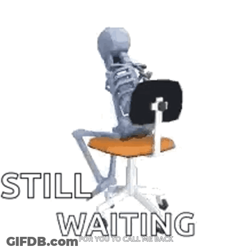 A Skeleton Is Sitting On A Chair With The Words `` Still Waiting '' Written On It . GIF