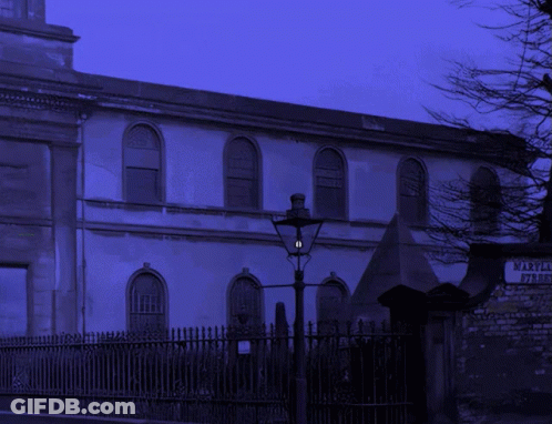 A Skeleton Is Standing In Front Of A Building That Says Maryland On It GIF