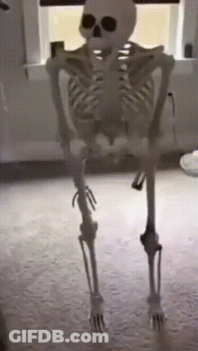 A Skeleton Is Standing In Front Of A Window In A Dark Room GIF