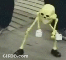 A Skeleton Is Standing On A Sidewalk Holding A Bottle And A Piece Of Paper . GIF