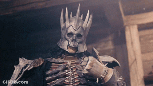 A Skeleton Wearing A Helmet With A Skull Face GIF