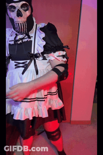 A Skeleton Wearing A Maid Costume With A Bow GIF